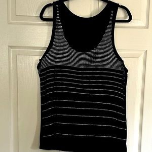 Black tank top w/ silver studs. Stunning under blazer, jean jacket, or alone!